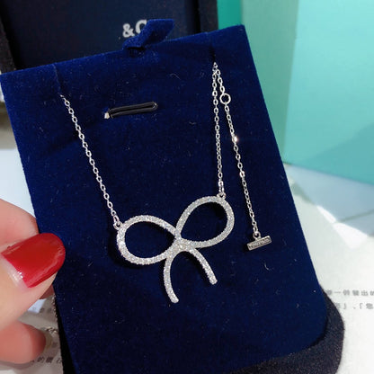 [Corinne]CLAW SET RHODIUM PLATED BOW NECKLACE