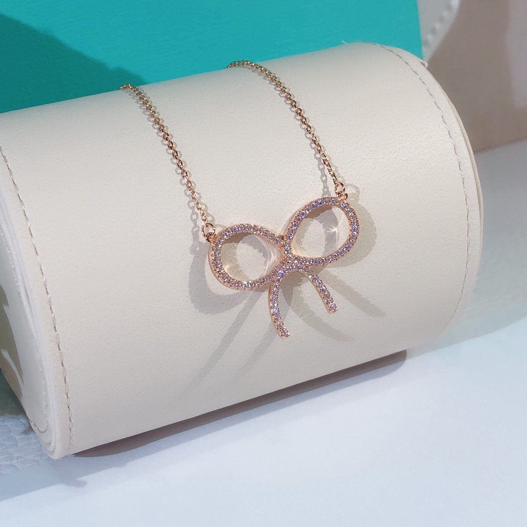 [Corinne]CLAW SET RHODIUM PLATED BOW NECKLACE
