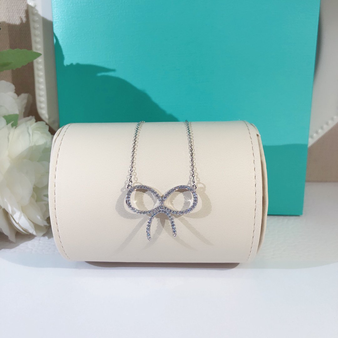 [Corinne]CLAW SET RHODIUM PLATED BOW NECKLACE